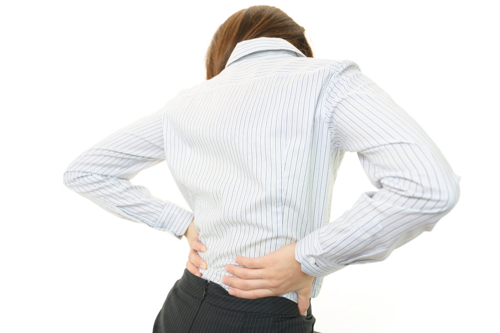 Woman suffering from back pain caused by a depuy ASR hip replacement