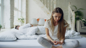 Depressed Young Woman Worried About Potential Complications Of Zoloft